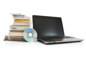Online education -Laptop, cd, stack books and magazines